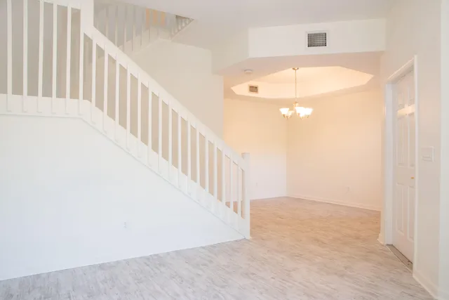 a view of a hallway with a white walls