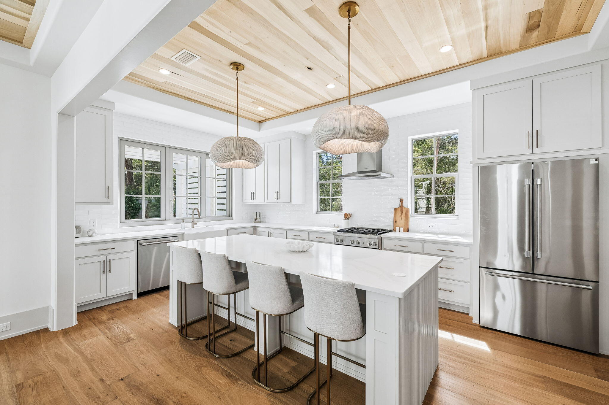 8 East Willow Mist Rd Inlet Beach Inlet Beach, FL 32461 - Photo 3 of 45 a kitchen with center island wooden floor and stainless steel appliances