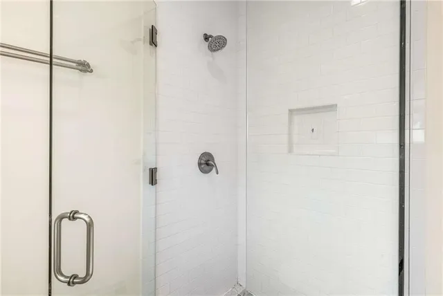 a white bath tub sitting in a bathroom