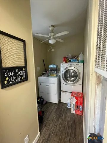 a utility room with sink dryer and washer