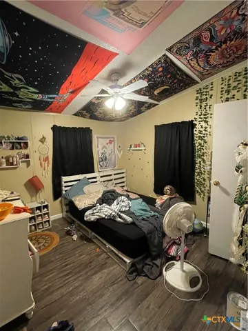 a bed room with furniture and flat screen tv