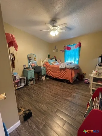 a room with furniture and wooden floor