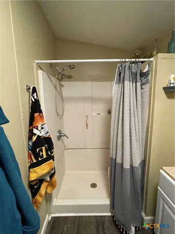 a bathroom with a bathtub and shower