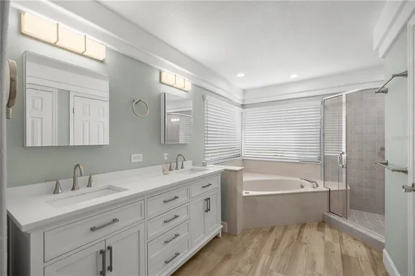 a bathroom with a shower and a bathtub