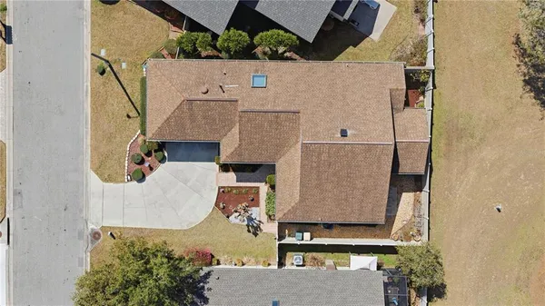 an aerial view of a house with outdoor space and street view
