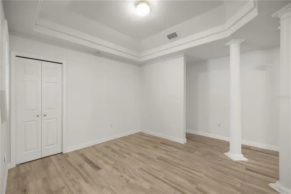 a view of hallway with wooden floor