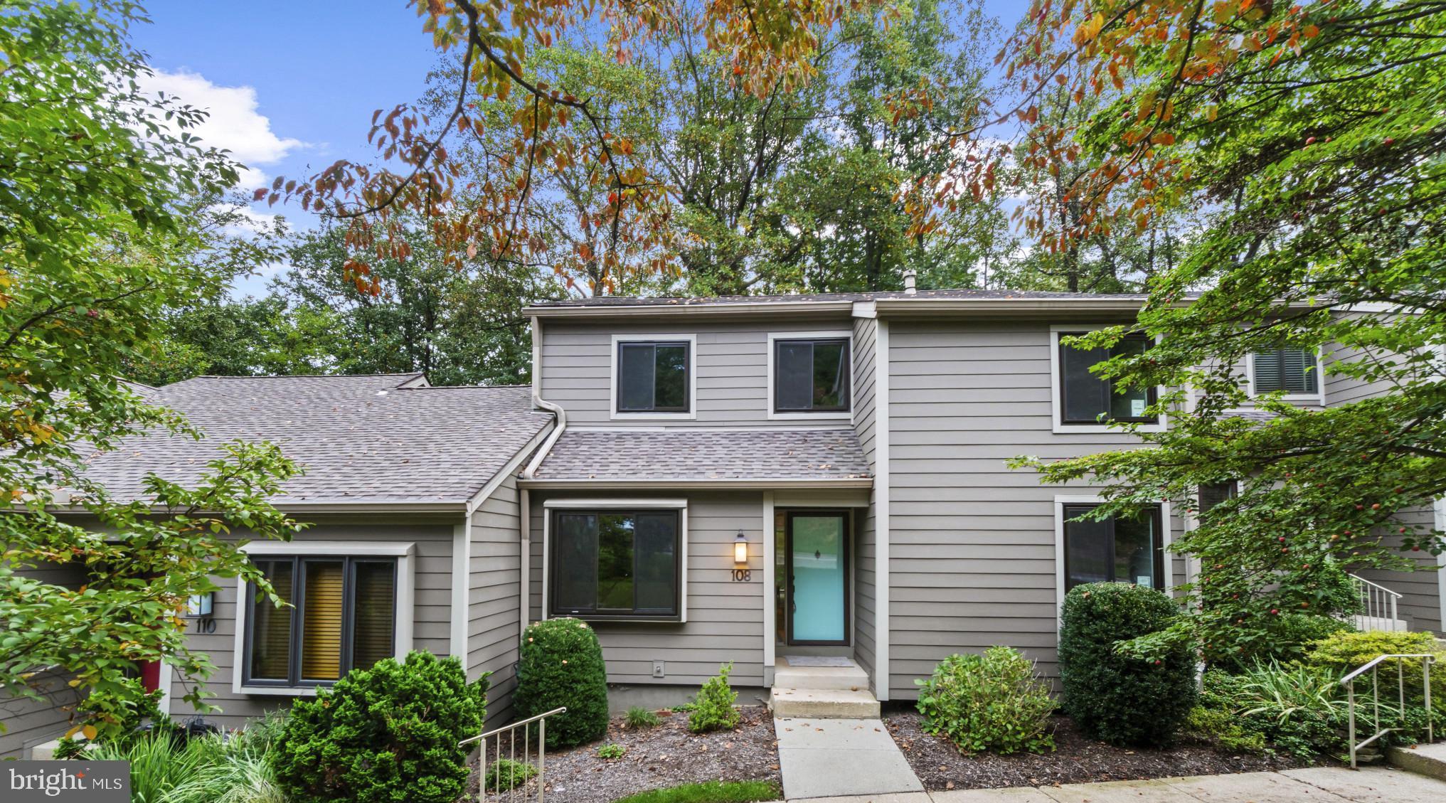 108 Beech Hill Lane, Unit 60 Baltimore, MD 21286 - Photo 1 of 27 a front view of a house with yard and trees
