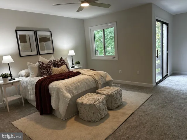 a bedroom with bed and window