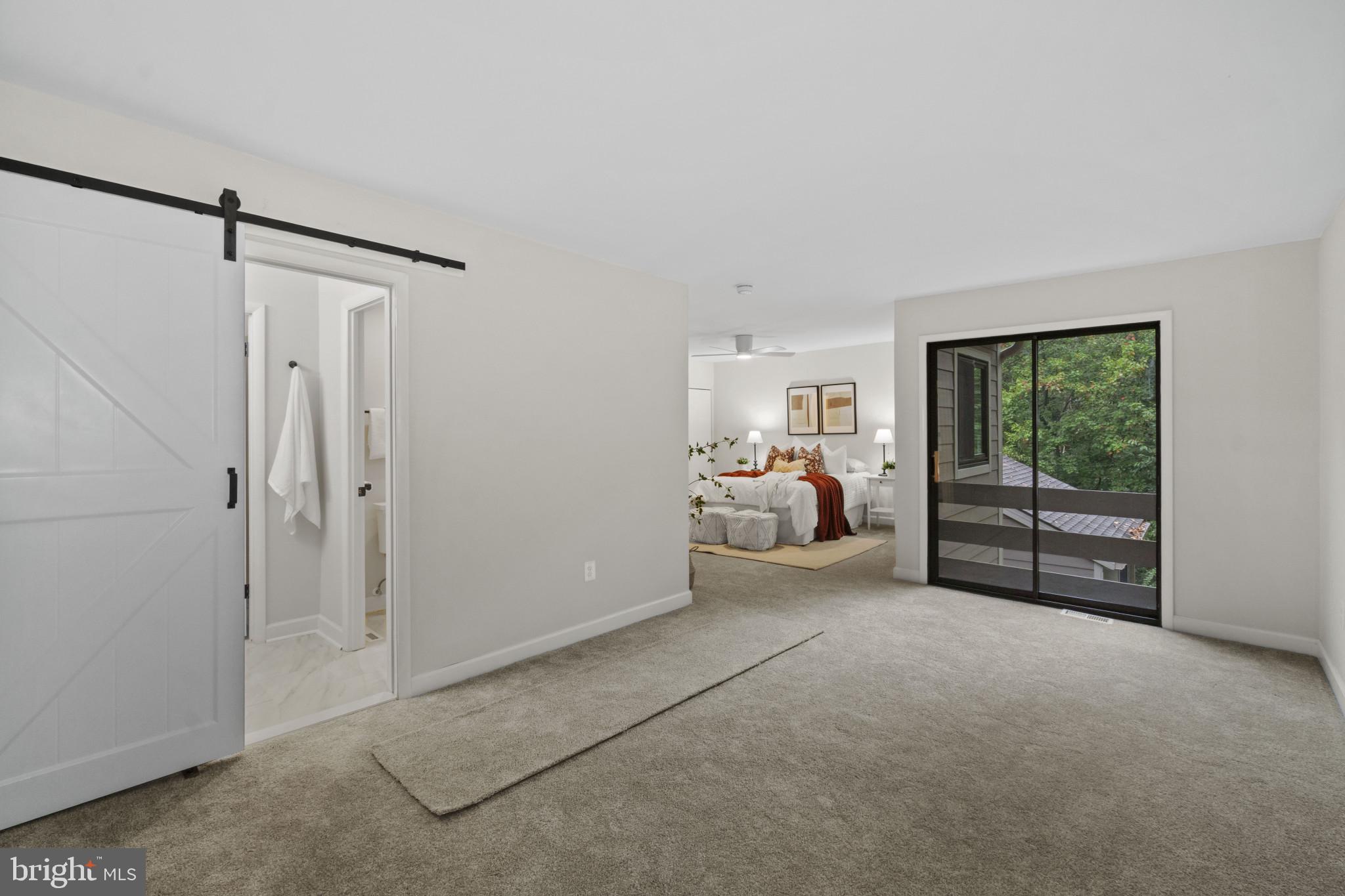 108 Beech Hill Lane, Unit 60 Baltimore, MD 21286 - Photo 13 of 27 a bed room with a bed and a television