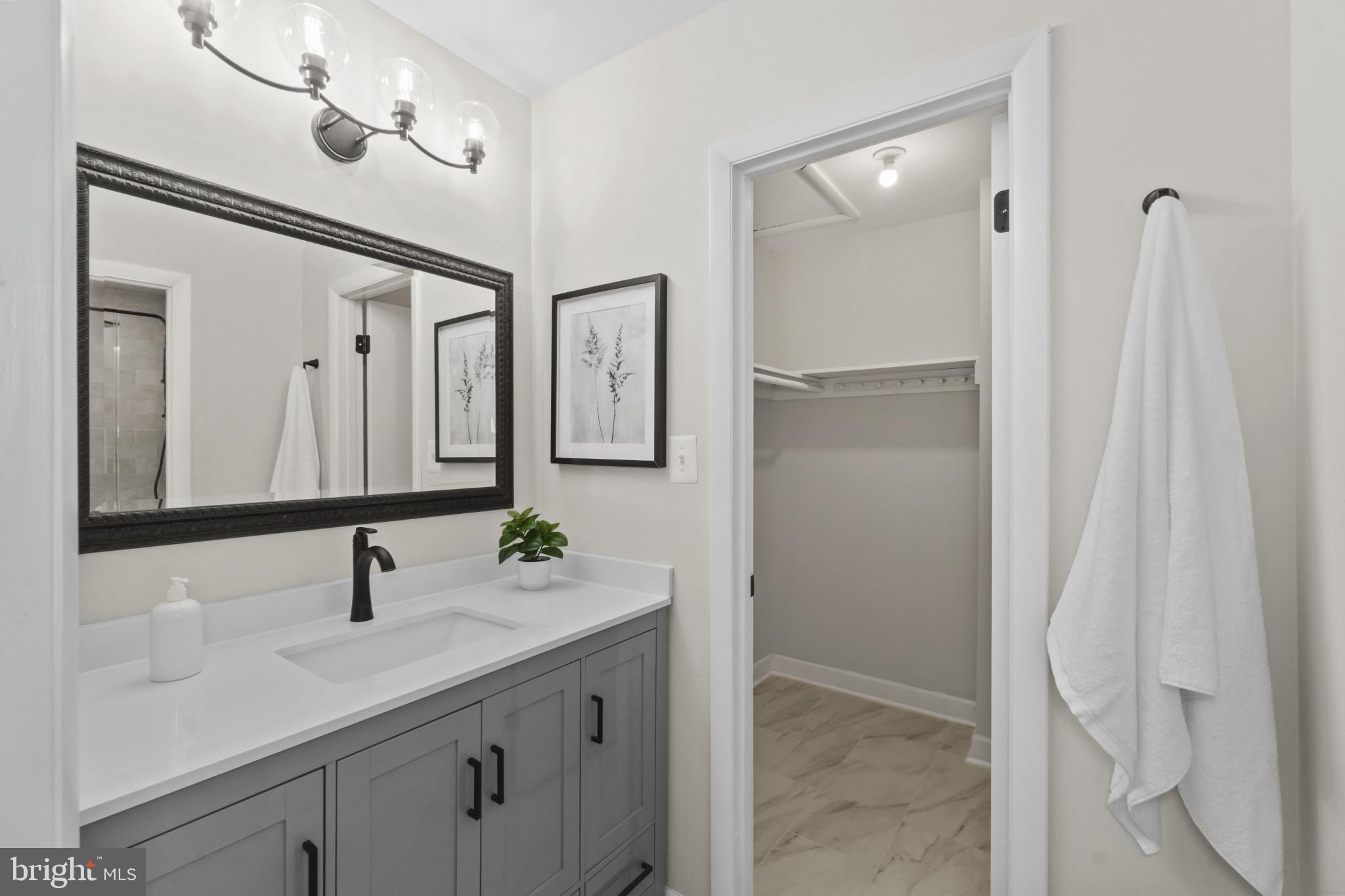 108 Beech Hill Lane, Unit 60 Baltimore, MD 21286 - Photo 14 of 27 a bathroom with a double vanity sink mirror and