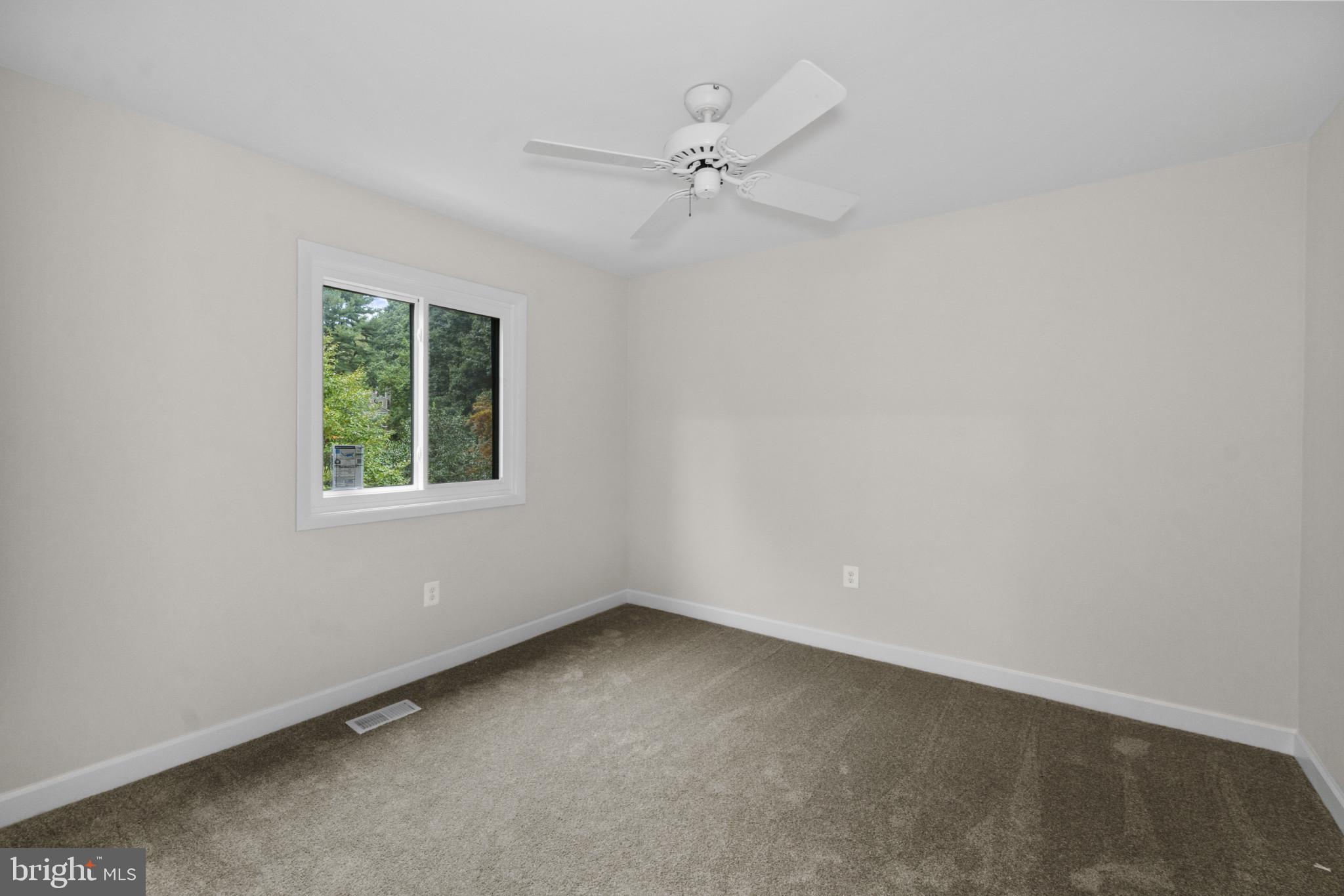 108 Beech Hill Lane, Unit 60 Baltimore, MD 21286 - Photo 17 of 27 an empty room with a window