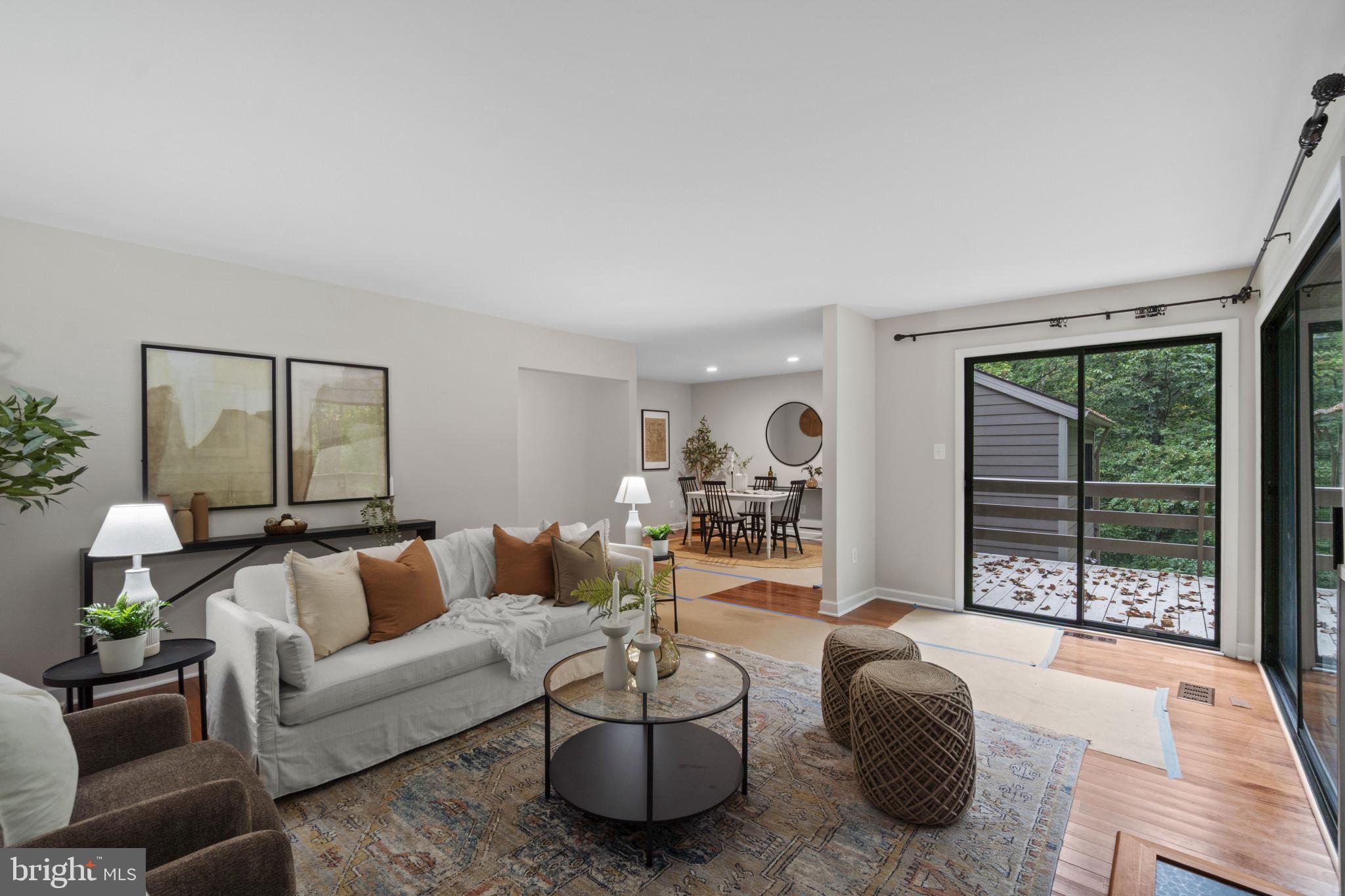 108 Beech Hill Lane, Unit 60 Baltimore, MD 21286 - Photo 2 of 27 a living room with furniture and a large window