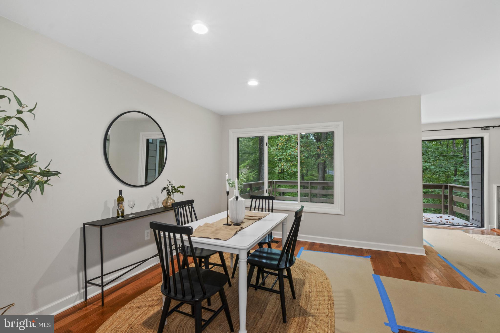 108 Beech Hill Lane, Unit 60 Baltimore, MD 21286 - Photo 6 of 27 a view of a dining room with furniture window and wooden floor