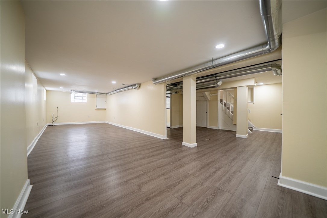 3816 Summit Park Road Cleveland Heights, OH 44121 - Photo 24 of 35 Below grade area featuring dark wood-style floors, stairway, and recessed lighting