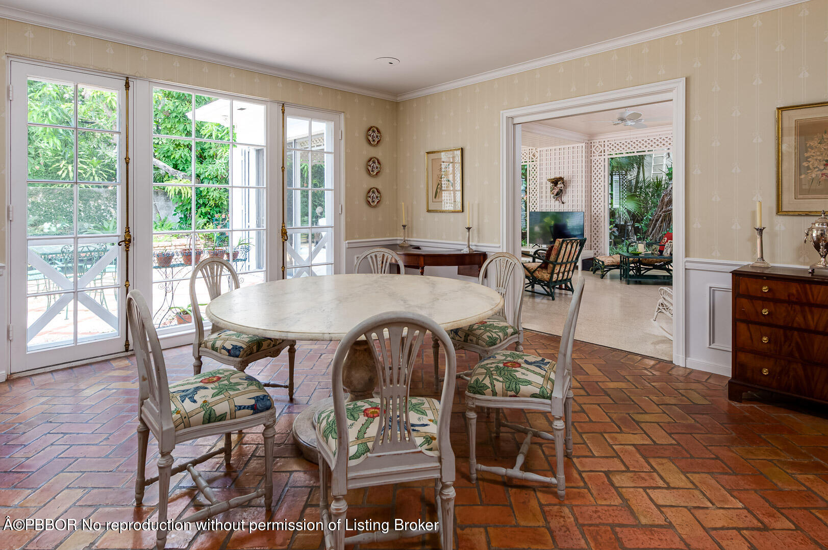 345 Pendleton Lane Palm Beach, FL 33480 - Photo 8 of 11 a dining room with furniture a chandelier and wooden floor