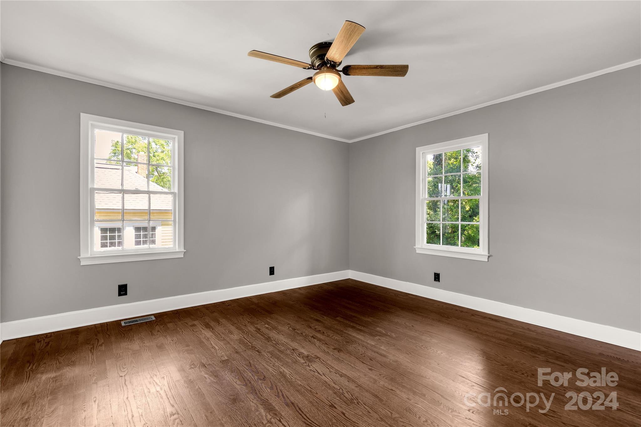 303 North White Street Lancaster, SC 29720 - Photo 13 of 24 a view of an empty room with wooden floor and a window