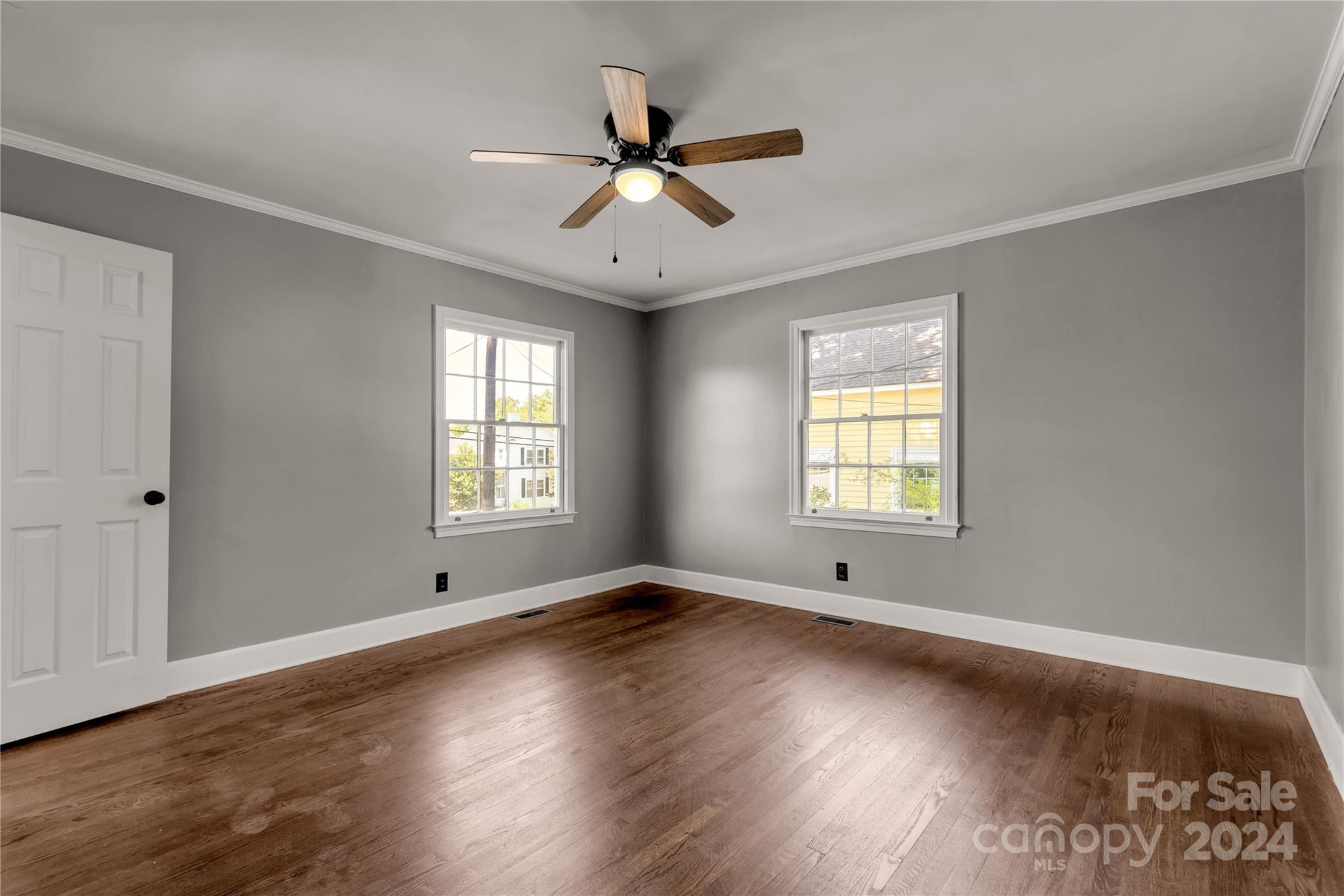 303 North White Street Lancaster, SC 29720 - Photo 15 of 24 a view of empty room with wooden floor and fan