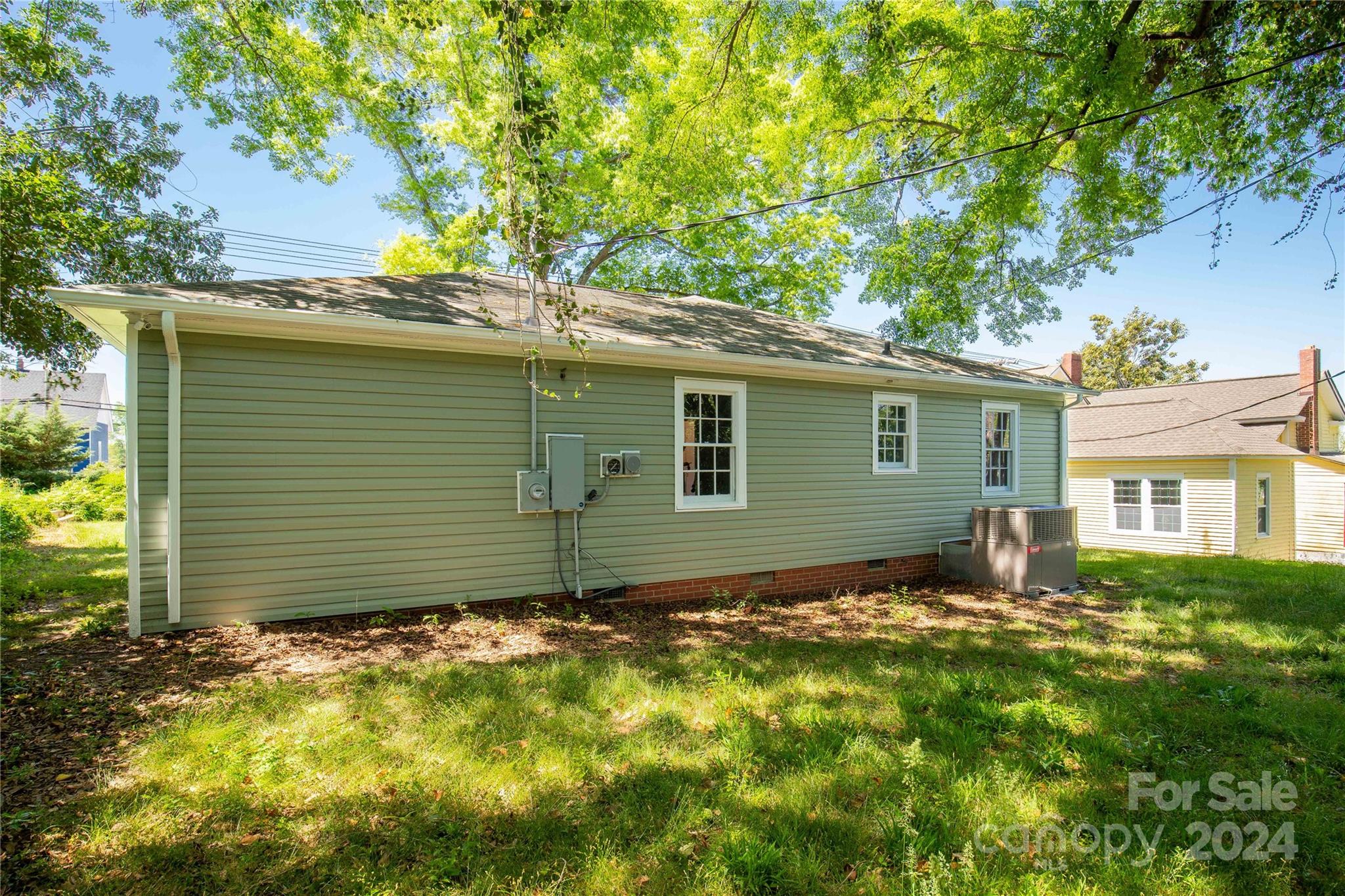 303 North White Street Lancaster, SC 29720 - Photo 20 of 24 a house with trees in front of it