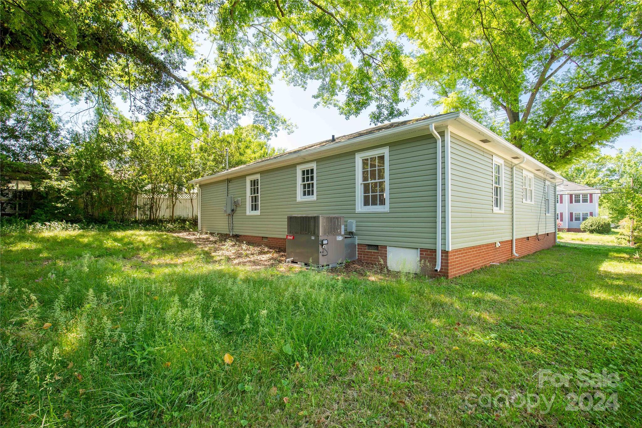 303 North White Street Lancaster, SC 29720 - Photo 22 of 24 a view of a house with a backyard