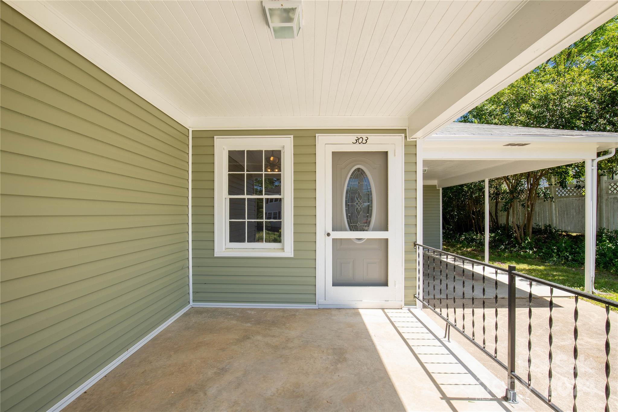 303 North White Street Lancaster, SC 29720 - Photo 3 of 24 a view of a house with a porch