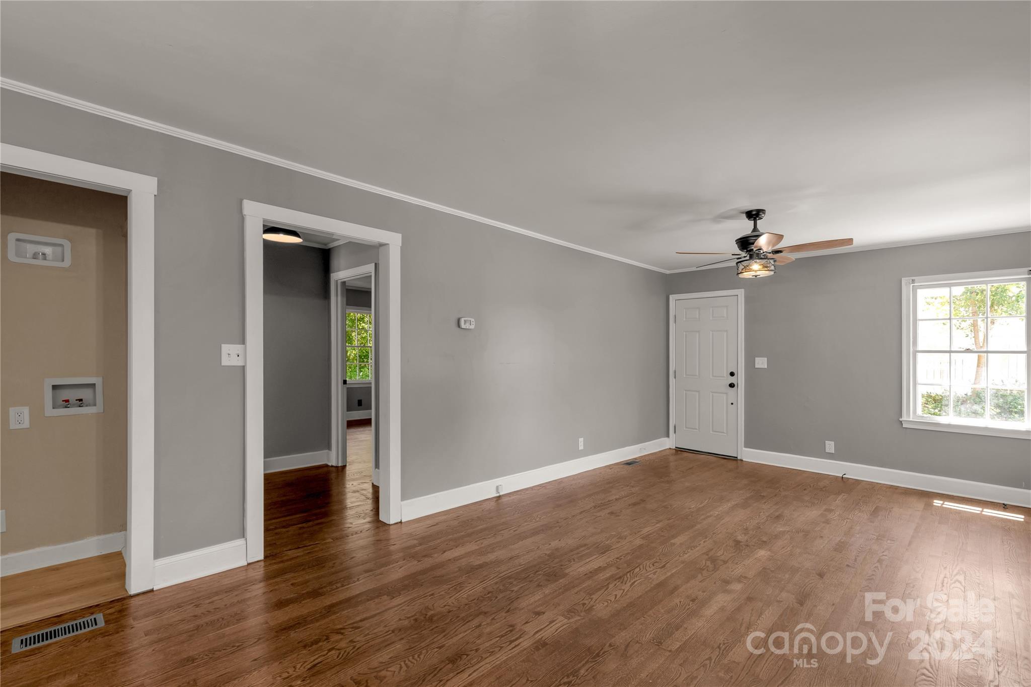 303 North White Street Lancaster, SC 29720 - Photo 7 of 24 wooden floor in an empty room with a window