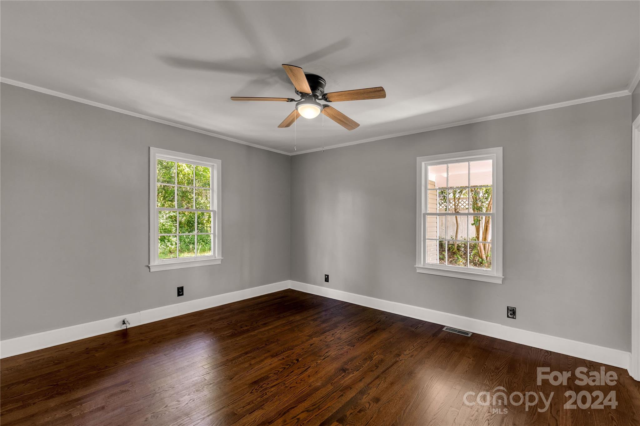 303 North White Street Lancaster, SC 29720 - Photo 10 of 24 a view of an empty room with wooden floor and a window