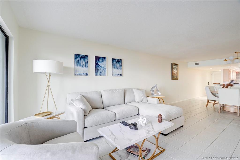 10 Northeast Plantation Road, Unit 101 Jensen Beach, FL 34957 - Photo 37 of 53 a living room with furniture and a couch