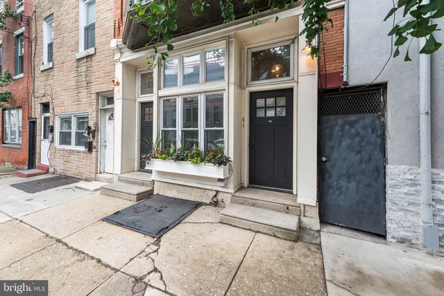 a view of a building with a window and front door
