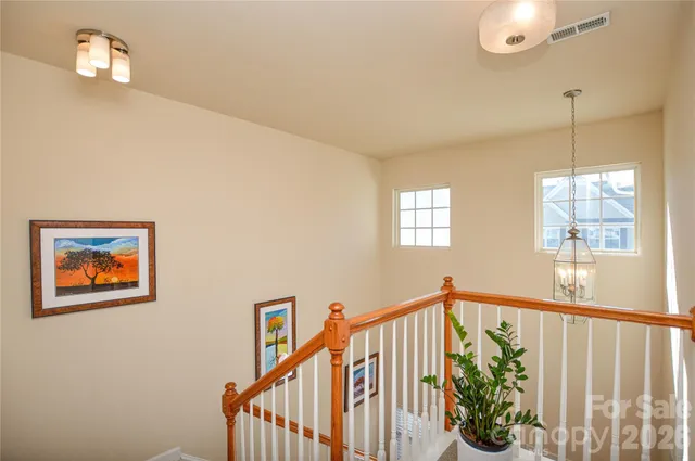 a view of a hallway with windows