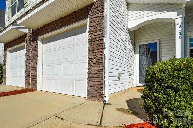 a view of a house with a garage
