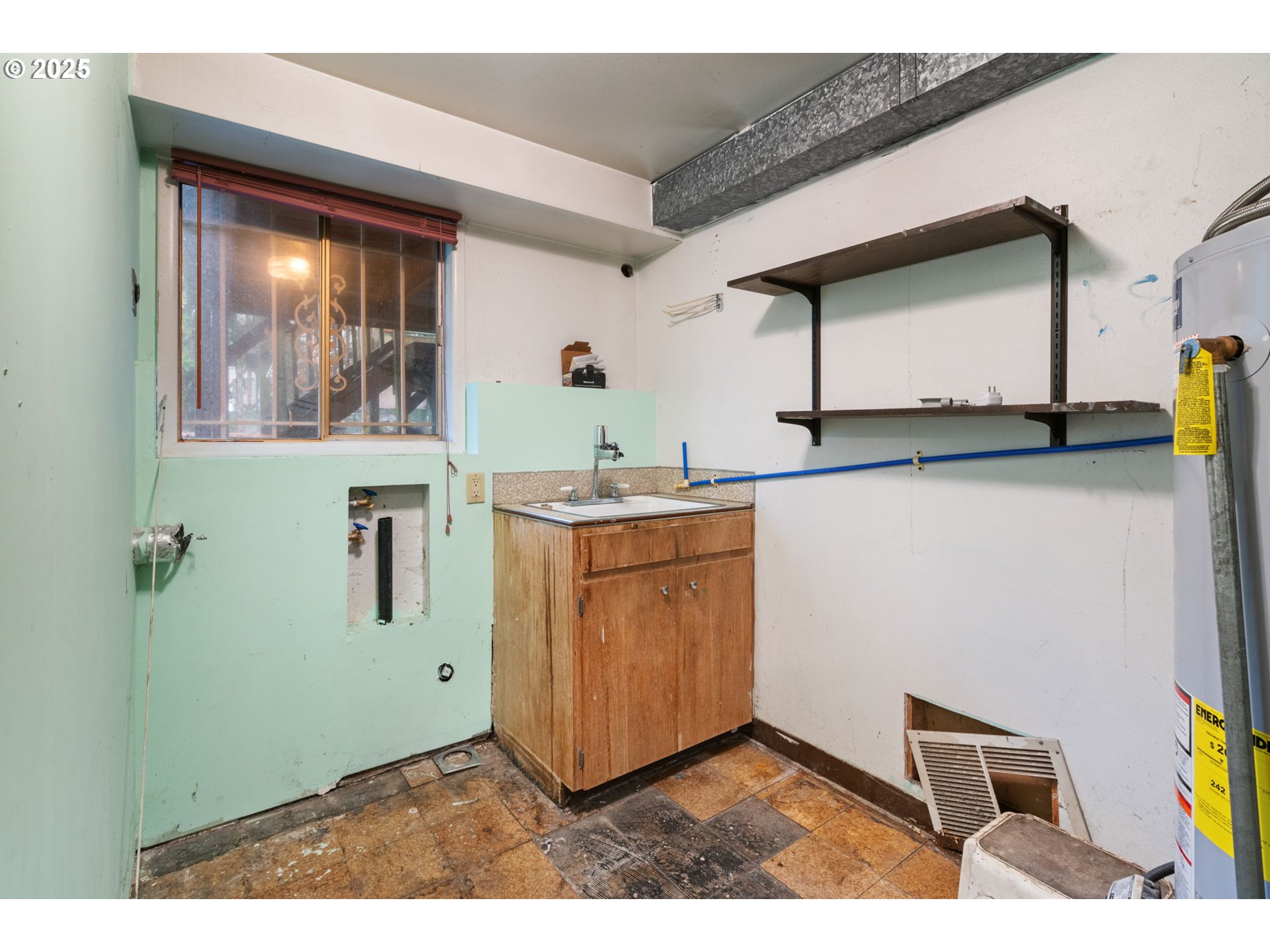 13122 Northeast Morris Court Portland, OR 97230 - Photo 31 of 38 a kitchen with a refrigerator and a sink