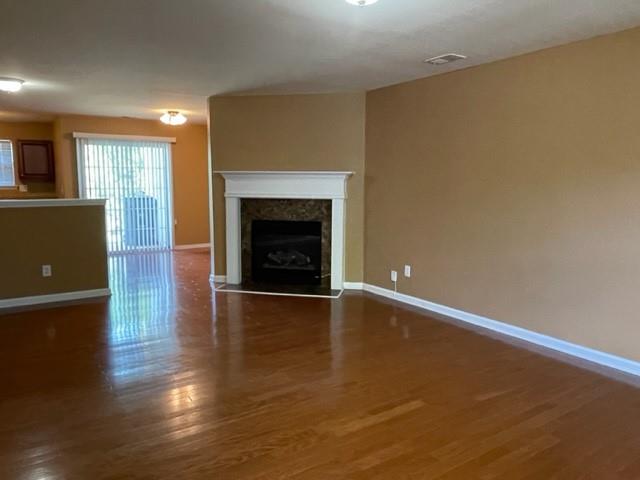 708 Crestwell Circle Atlanta, GA 30331 - Photo 3 of 23 a view of an empty room with wooden floor and a fireplace
