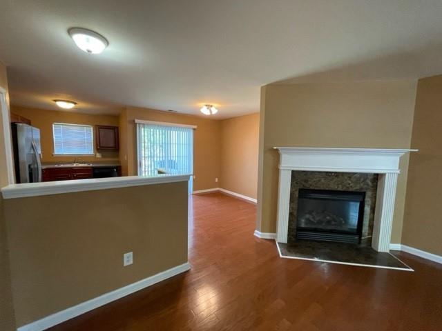708 Crestwell Circle Atlanta, GA 30331 - Photo 6 of 23 a living room with stainless steel appliances granite countertop a fireplace a flat screen tv and a fireplace