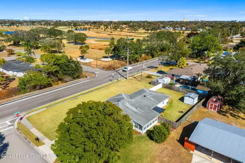 an aerial view of residential houses with outdoor space