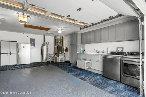 a view of a kitchen with a sink and a window