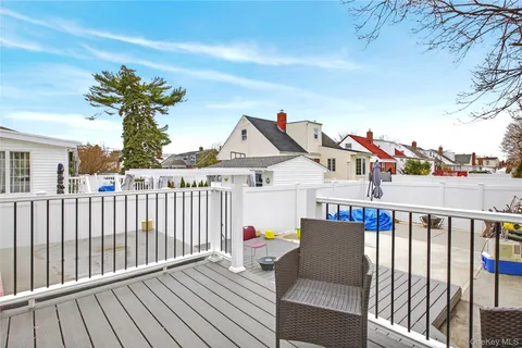 a view of a house with wooden deck