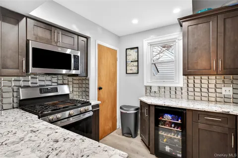 a kitchen with a stove and a microwave