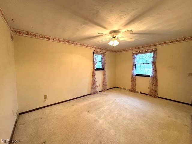 2036 Salt Springs Road Warren, OH 44481 - Photo 7 of 23 Empty room featuring ceiling fan and carpet flooring