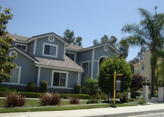 1461 Crestview Road Redlands, CA 92374 - Photo 1 of 1 a front view of a house with a yard and potted plants