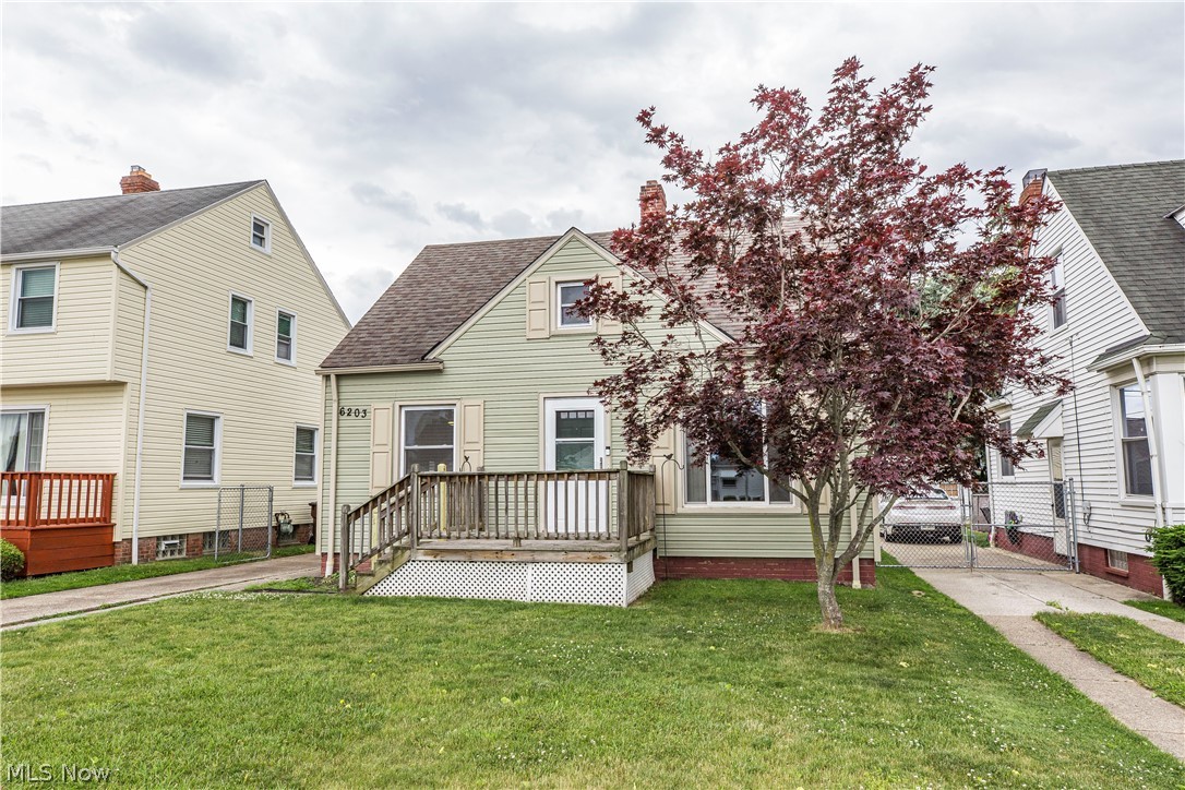 6203 Snow Road Parma, OH 44129 - Photo 28 of 29 View of front facade featuring a front yard and a deck