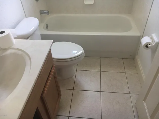 a bathroom with a sink and toilet