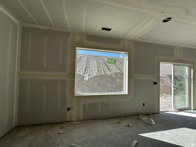 513 East Upper Cyn Road Smithfield, UT 84335 - Photo 20 of 25 Interior space under construction featuring drywall-finished walls and ceiling, a rectangular window, and a sliding glass door