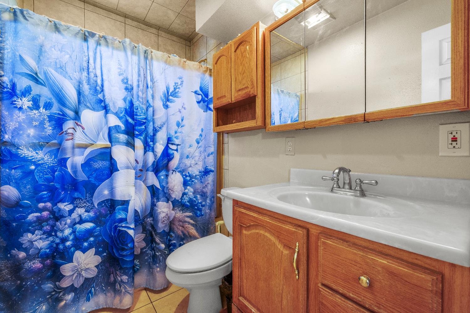 808 Cadillac Drive Modesto, CA 95351 - Photo 17 of 41 Main bathroom features vanity, shower with tub, and tile flooring