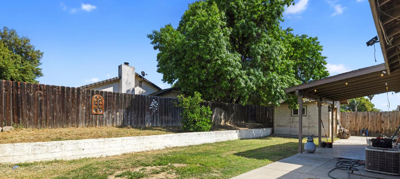 808 Cadillac Drive Modesto, CA 95351 - Photo 26 of 41 fenced backyard with a patio