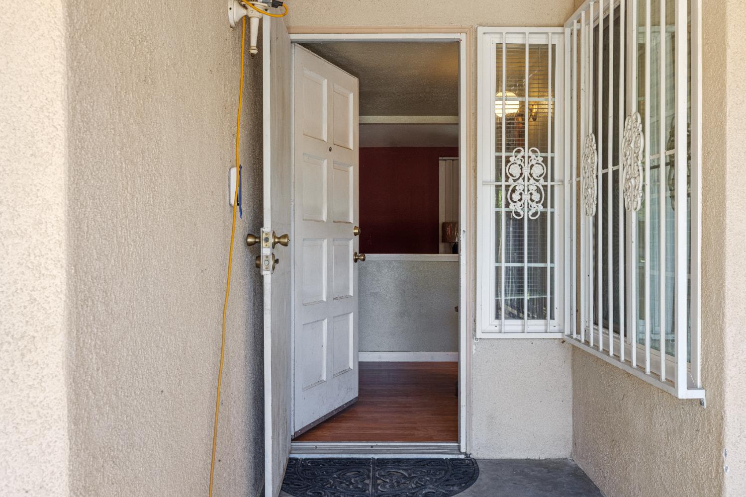 808 Cadillac Drive Modesto, CA 95351 - Photo 3 of 41 property entrance with stucco siding and covered patio