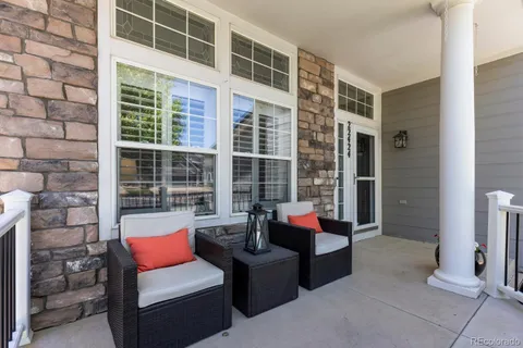 a outdoor living space with patio furniture and a fireplace