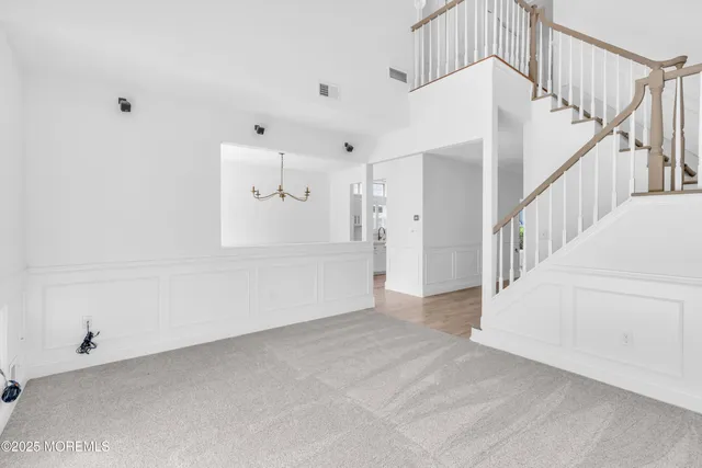 a view of a hallway with windows