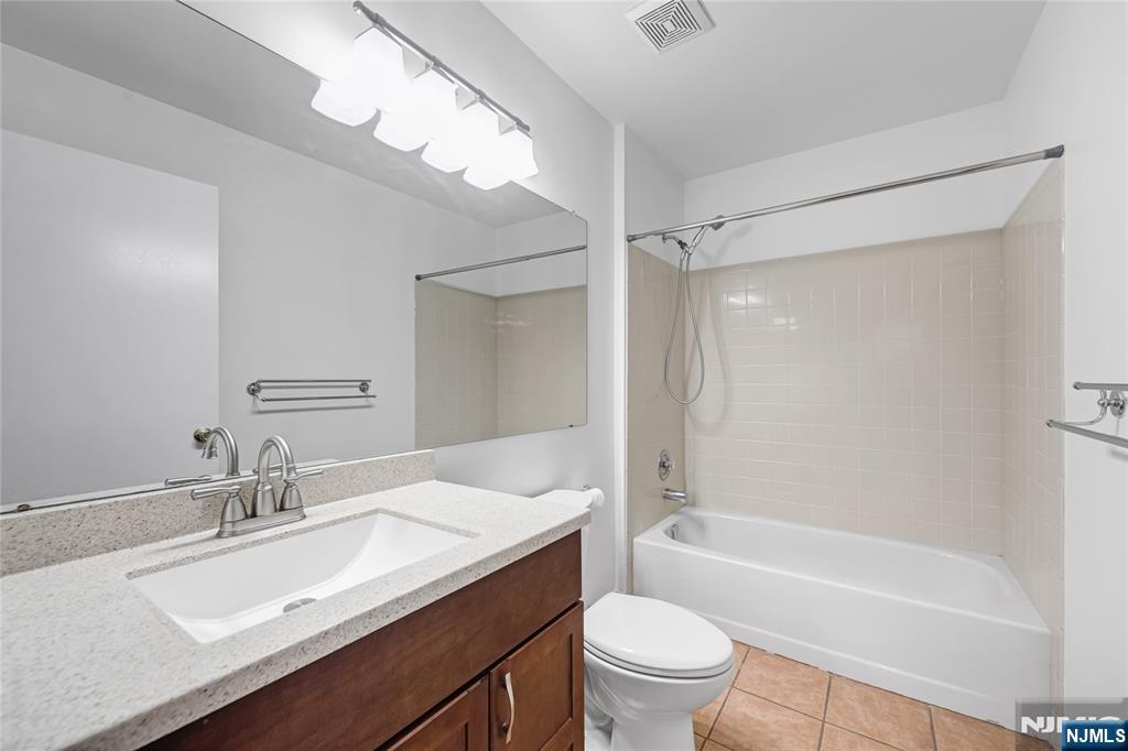 581 Holly Court Mahwah, NJ 07430 - Photo 11 of 21 a bathroom with a granite countertop sink toilet and shower