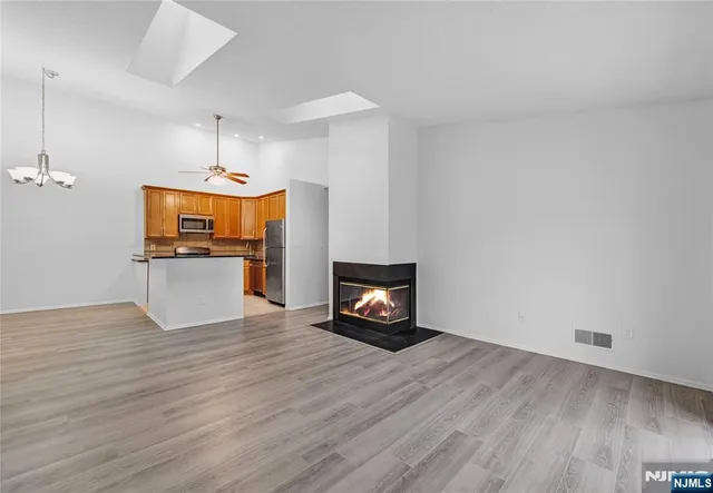 a view of a kitchen with a sink and a microwave