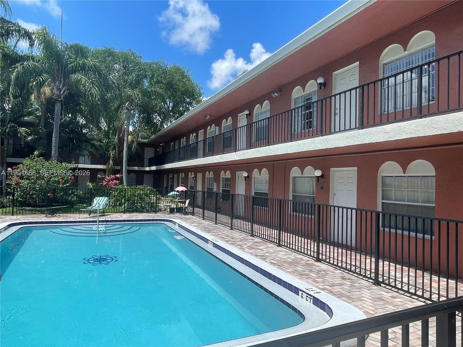 1405 Miami Road, Unit 23 Fort Lauderdale, FL 33316 - Photo 1 of 20 a view of a balcony with a swimming pool